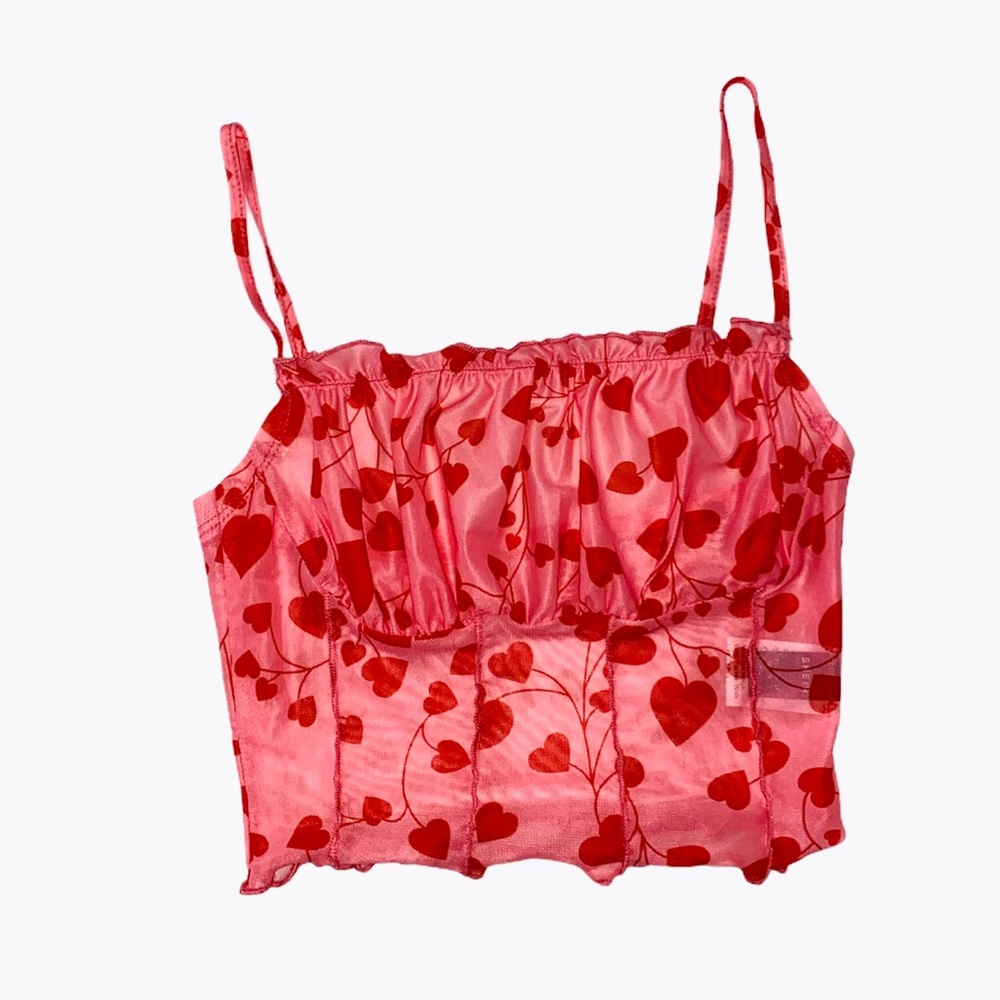 Sheer pink and red heart print top.